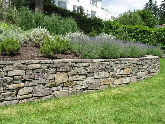 Building a Stone Retaining Wall - JCs Landscaping